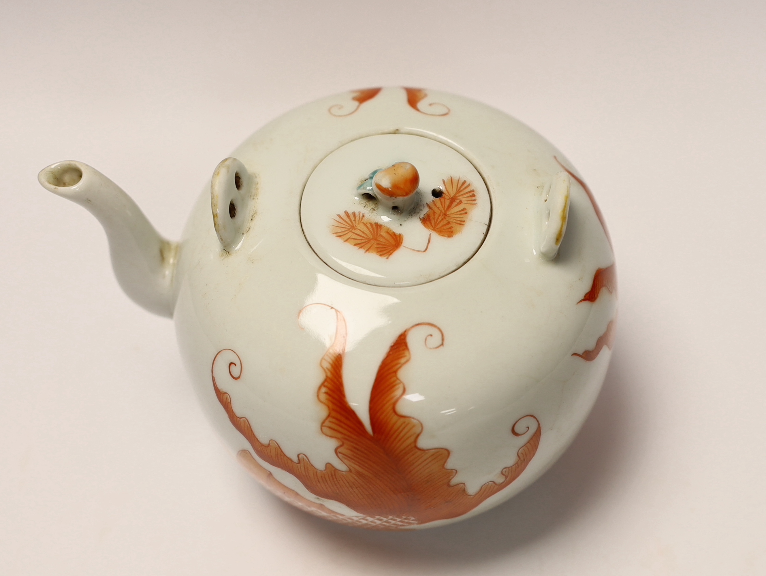 A Chinese iron red enamelled globular teapot, 11.5cm